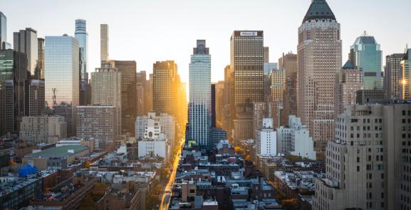 sunset over a skyscrapers and buildings